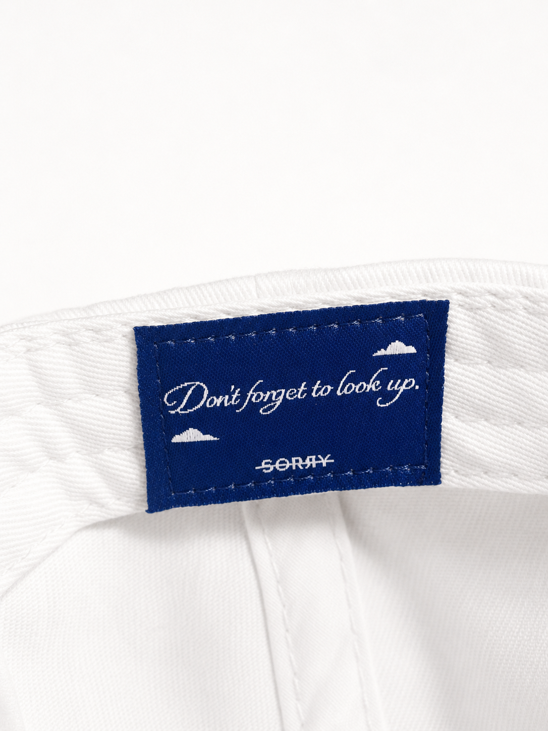 SORRY Tennis Club Hat - White label detail